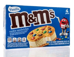 A package of MMs frozen ice cream cookie sandwiches on an isolated background
