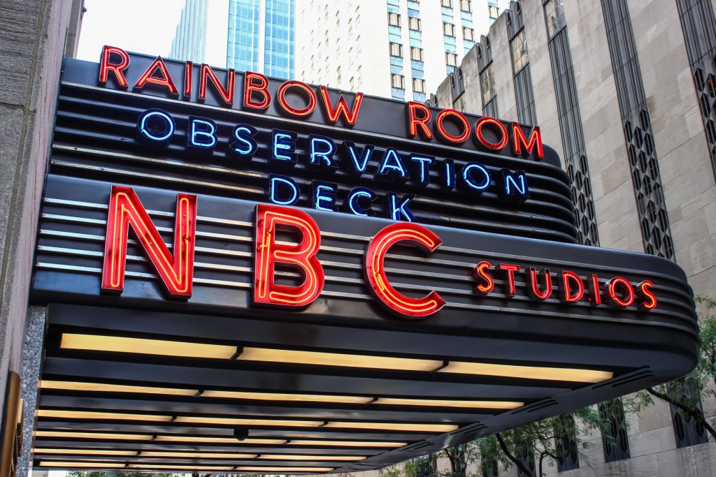 NEW YORK, USA - SEPTEMBER 3TH 2019: NBC Studios sign, Rockefeller Center in midtown Manhattan. Known as the world headquarters for NBC News, the Saturday Night Live studios and the Rainbow Room.
