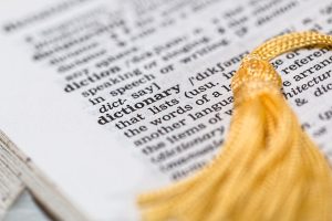 dictionary page with a yellow tassel on it