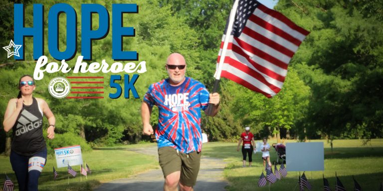 Runner carrying american flag